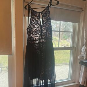 Navy blue, knee length dress with train. Never worn, size 16